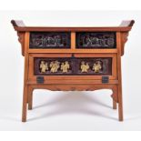 A 20th century Chinese side cabinet with two relief moulded drawers over a drop flap cupboard, 97 cm