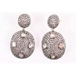 A pair of silver gilt diamond earrings set with flat- and rose-cut diamonds, set in white metal (