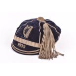 A turn of the century Leinster rugby honours cap  with embroidered harp motif on a blue velvet