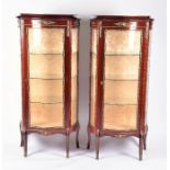 A pair of Louis XV style reproduction vitrine display cabinets 20th century, applied with gilt metal