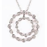 An 18ct white gold and diamond double wreath pendant set with round-cut diamonds, suspended on an