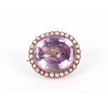 An early to mid 19th century amethyst brooch the large faceted amethyst with foil backing, within