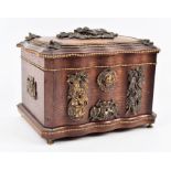 A German ormolu mounted oak cigar casket the shaped box with gilt beaded rims, the cover mounted