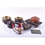A collection of miscellaneous items to include a pair of Chinese binding shoes, a figural oil burner