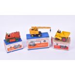 A Dinky Supertoys 563 Heavy Tractor in orange and green, together with a 562 Dumper Truck and a