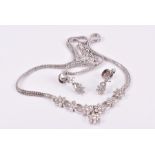 An 18ct white white gold and diamond necklace set with seven clusters of round brilliant-cut