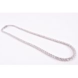 An 18ct white gold and diamond line necklace set with graduated round brilliant-cut diamonds of