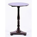 A 19th century tilt-top occasional table with circular top on a turned column and tri-form base,