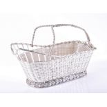 A Christofle, Paris silver plated lattice woven wine bottle boat with twisted wirework handle,