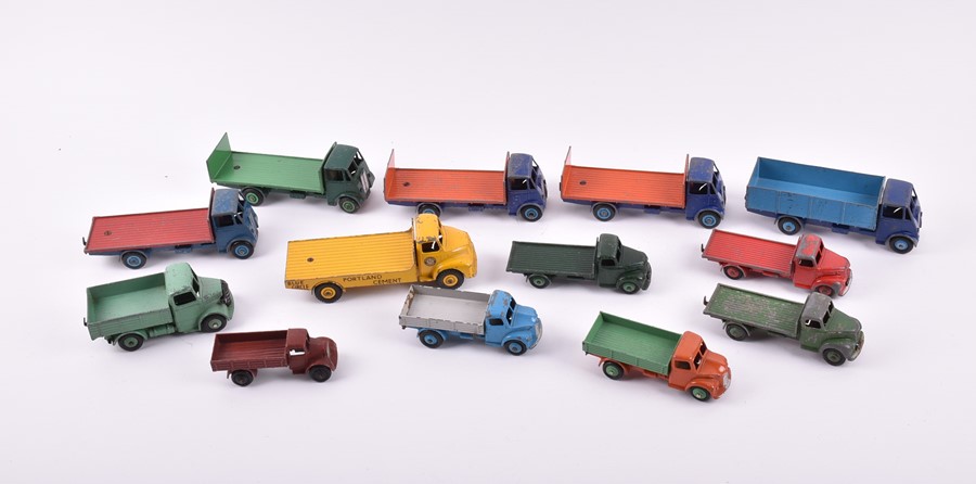 A collection of loose and playworn Dinky Toys vehicles to include three 422 Fordson Trucks, a 533