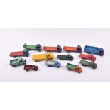 A collection of loose and playworn Dinky Toys vehicles to include three 422 Fordson Trucks, a 533