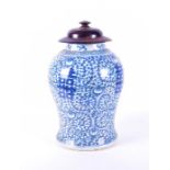 A late 19th century Chinese blue and white lidded vase the baluster shaped body decorated with