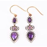 A pair of silver gilt, diamond, amethyst, and seed pearl drop earrings each with an oval amethyst