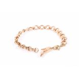 An Italian yellow gold textured link bracelet stamped KT18, suspended with a high heeled shoe-shaped