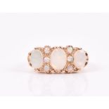 A 9ct yellow gold and opal ring set with three oval-cut opals and six round-cut opals, size Q, 5.2