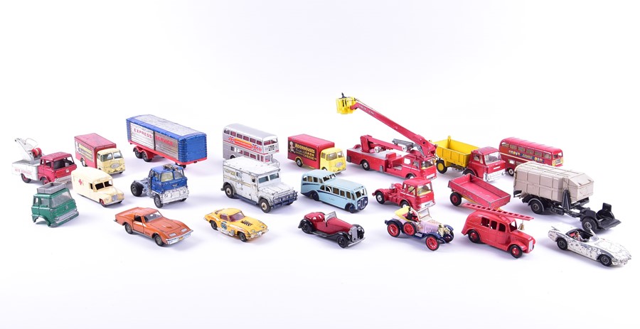 A collection of loose and playworn Dinky diecast vehicles to include buses, fire engines, commercial