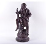 A large bronzed cast spelter figure 'Arts' an artist in traditional 19th century dress perches on