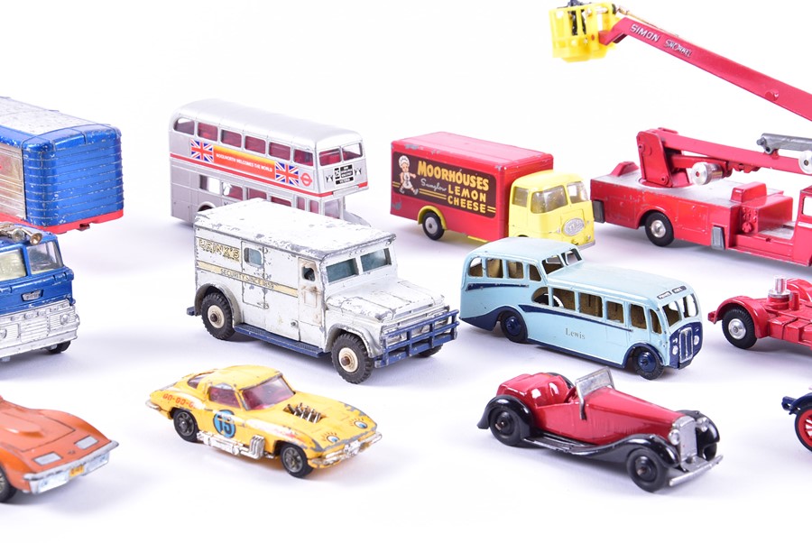 A collection of loose and playworn Dinky diecast vehicles to include buses, fire engines, commercial - Image 4 of 8