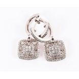 A pair of 18ct white gold and diamond drop earrings the openwork squared mounts with diamonds to