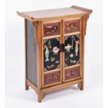 A 20th century Chinese wooden side cabinet the double front doors inset with hardstone panels with