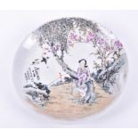 A Chinese Republic period porcelain plate depicting a central scene of a maiden in a field