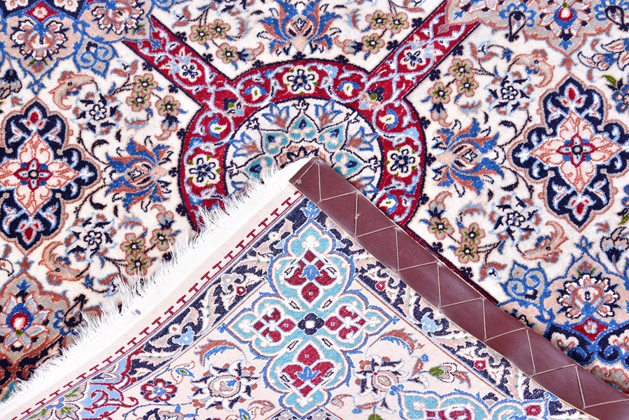 A contemporary Iranian part silk carpet with fringed ends, the ivory field decorated with a stylised - Image 2 of 5