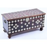 A small Eastern coffer or blanket box with applied white metal decoration, on bun feet, 88 cm x 39