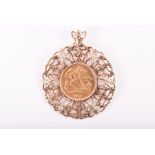 An Edward VII 1902 gold half sovereign pendant in a 9ct yellow gold pendant mound. 12 grams.