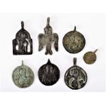 A collection of 12th/13th century Russian small pendant icons housed in an Edwardian shield