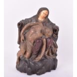 An 18th century Continental ivory mounted carved wooden sculpture of the Pieta modelled as Jesus