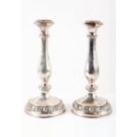 Judaica. A pair of Austro-Hungarian Sabath candlesticks circa 1884, of tapering form with gourded