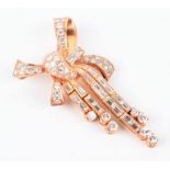 An articulated diamond bow pendant / brooch set with round and baguette-cut diamonds in gilt