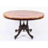 A late Victorian walnut and inlaid oval loo table  with quarter-veneered top, the matched base on