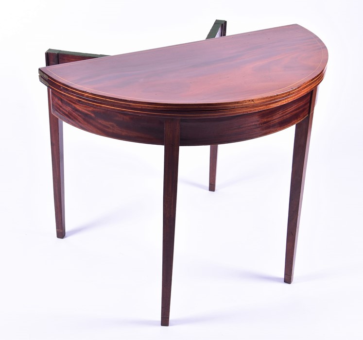 An Edwardian flame mahogany demi-lune card table with satinwood cross banding and baize lined - Image 5 of 5