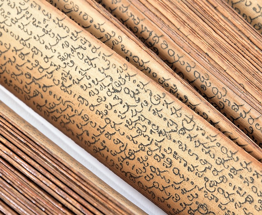 An antique South East Asian Buddhist prayer manuscript hand written calligraphy on palm leaves, with - Image 2 of 3