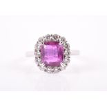An 18ct white gold, diamond, and pink sapphire cluster ring set with a rectangular cushion-cut