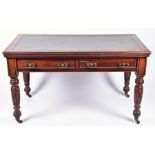 A Victorian mahogany library table with tooled green leather top over two frieze drawers and