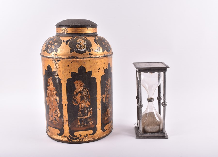 A large Chinese painted and gilt tin tea jar of circular form, the body decorated to the front