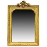 A 19th century wood and gesso wall mirror  the rectangular mirror housed in an elaborately decorated