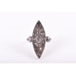 An unusual yellow metal and diamond navette ring the silver mount inset with fifteen mixed rose-