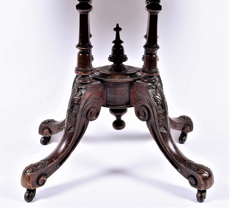 A late Victorian walnut and inlaid oval loo table  with quarter-veneered top, the matched base on - Image 5 of 5