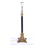 A late 19th century French Empire style floor lamp with central reeded black column surmounted