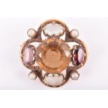 A late 19th / 20th century yellow metal, citrine, amethyst and faux pearl brooch in the Celtic