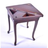 A 19th century Continental stained oak travelling or clerk's gate-leg desk the folding top opening