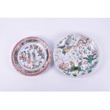 Two Chinese Kangxi period Famille verte plates one with ribbed border with central garden scene