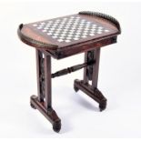 An unusual George IV rosewood & marquetry games table the galleried side flanking a sliding and