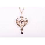 A late 19th / early 20th century 9ct yellow gold, amethyst and split seed pearl pendant of