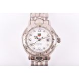A ladies Tag Heuer automatic Chronometer wrist watch with a white dial with illuminated markers,