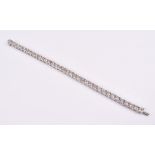 An impressive diamond line bracelet set with thirty six round-cut diamonds, of approximately 21.0