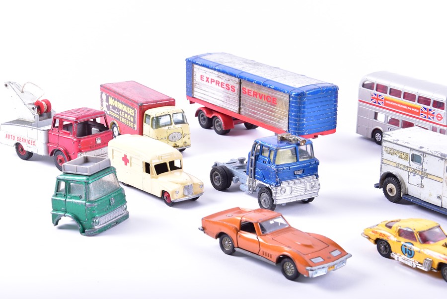 A collection of loose and playworn Dinky diecast vehicles to include buses, fire engines, commercial - Image 3 of 8